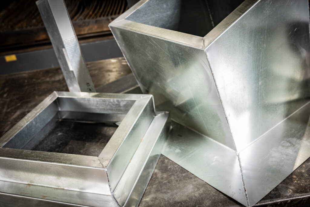 Precision-crafted roof curbs, including flat and pitched configurations, custom-built by DuctWorx to support HVAC units and provide seamless roof integration.