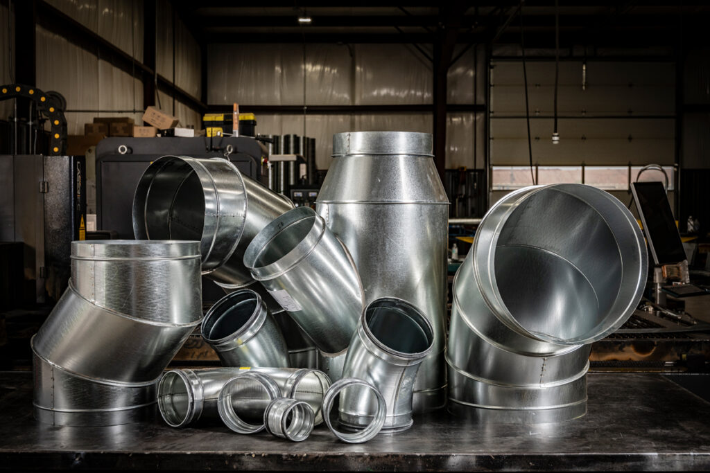 Precision-engineered round duct fittings and spiral pipe systems from DuctWorx, built to SMACNA standards for high-efficiency airflow and long-lasting durability in HVAC applications.