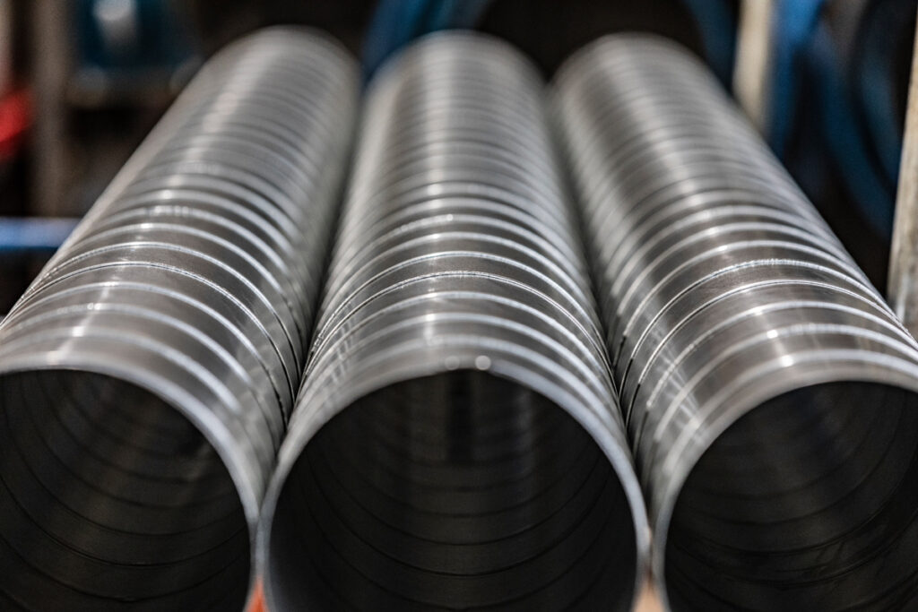 Close-up of high-efficiency spiral ductwork from DuctWorx, fabricated to SMACNA standards for durable, low-leakage HVAC duct systems.